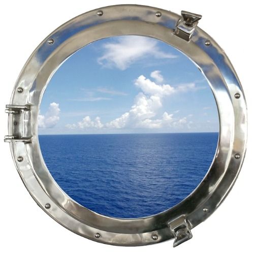 an open porthole window on the side of a ship looking out at the ocean