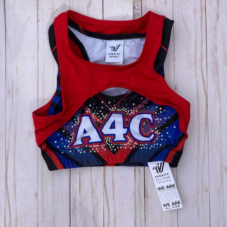 a women's red tank top with the letter a4c printed on it