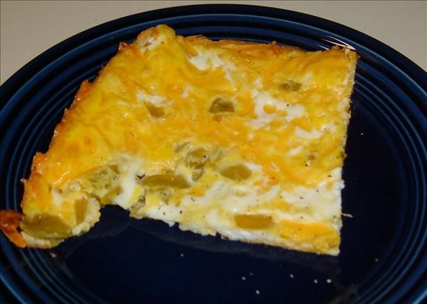 a piece of quiche on a blue plate