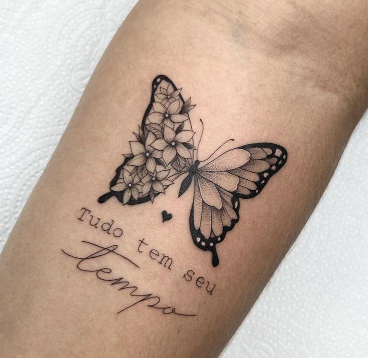 a tattoo with two butterflies on it and the words i love you in cursive writing