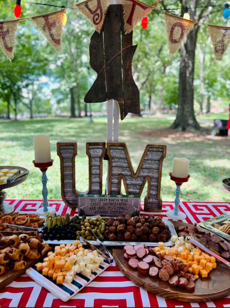 a table topped with lots of different types of food and desserts on top of it