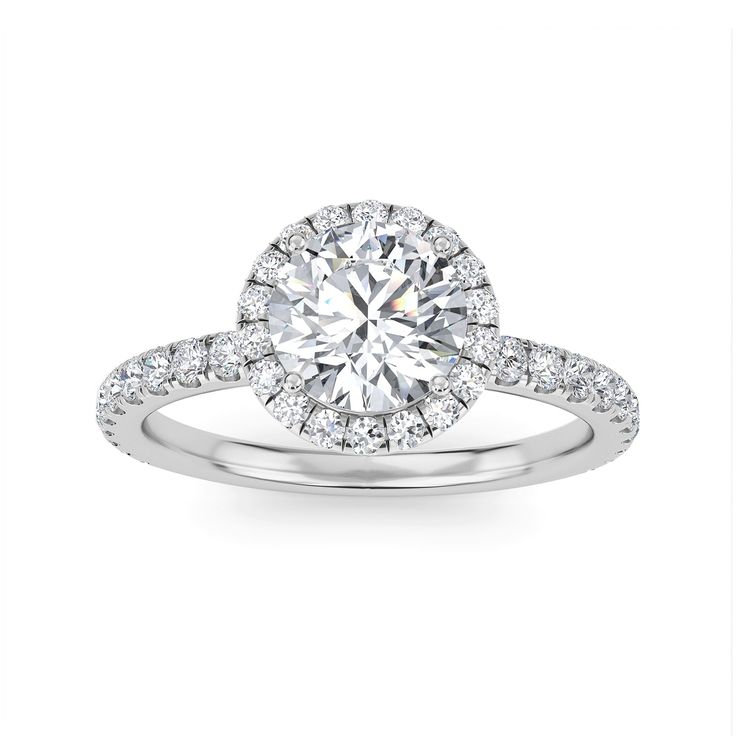 a white gold engagement ring with diamonds on the band