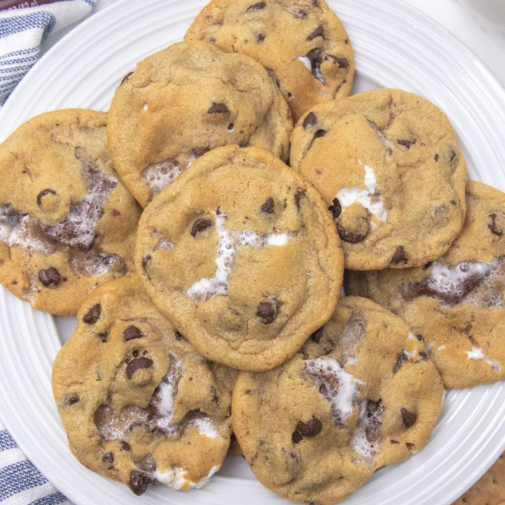 a white plate topped with chocolate chip cookies