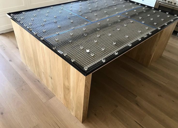 a kitchen island made out of legos on top of a hard wood flooring