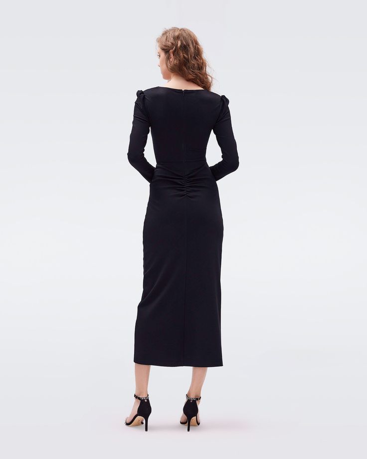 A classic little black dress, the Hughie midi is cut from a soft jersey. This piece has long sleeves, slightly puffed shoulders, a subtle sweetheart neckline, and flattering ruching that gathers at the hip. LENZING™ ECOVERO™ Viscose fibers are created from renewable wood sources and manufactured using less water and emitting less CO2. Better for the environment, better for your style.Yana is 5 Foot and 8 Inches and wearing a size XS. Wrap Dress Dvf, Classic Little Black Dress, Midi Wrap Dress, Wrap Dress Floral, Sweater Sale, Mini Wrap Dress, Knee Length Dresses, Bag Dress, Maxi Wrap Dress