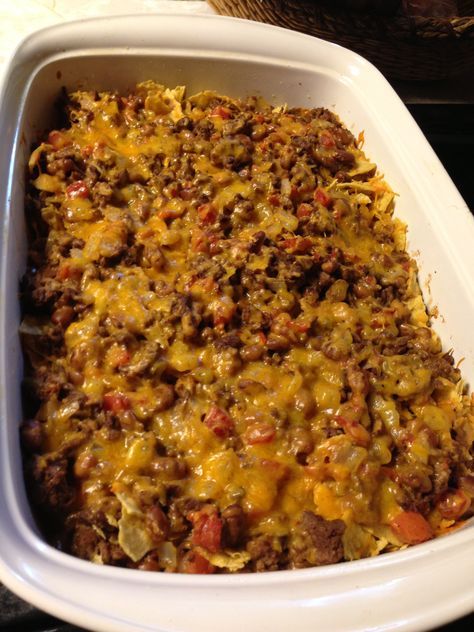 a casserole dish filled with meat and cheese