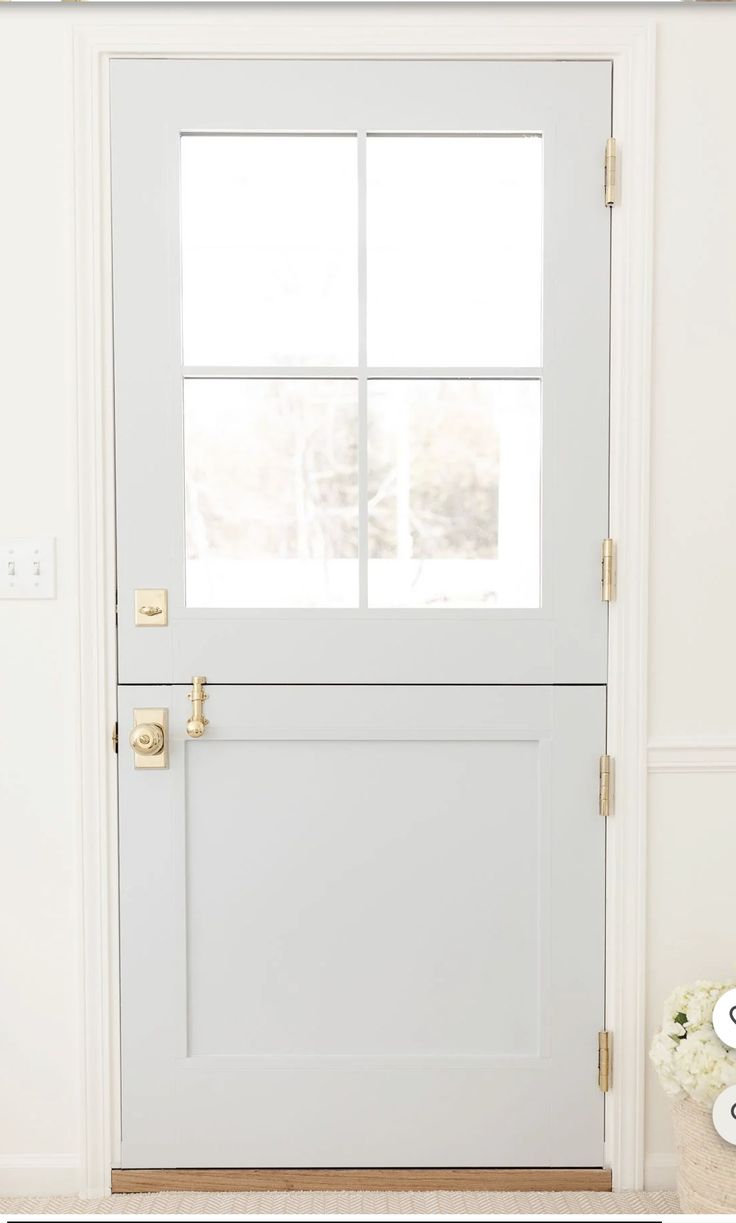 a white front door with two windows