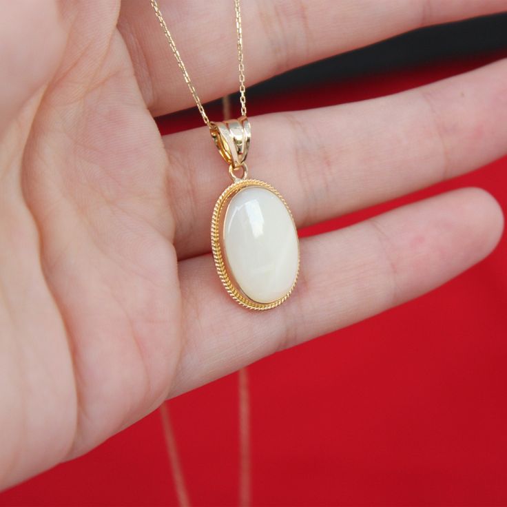 "Real Mother of Pearl Necklace 14k Gold Raw White Nacre Oval Necklace Vintage Style Boho Necklace Handmade Jewelry Christmas Gift For Women ▶ 𝙋𝙍𝙊𝘿𝙐𝘾𝙏 𝙁𝙀𝘼𝙏𝙐𝙍𝙀𝙎 * 14k Yellow Gold Mother of Pearl Necklace * Mother of Pearl Width : 1.23 cm ( 0.48 in) * Mother of Pearl Lenght : 1.75 cm ( 0.68 in) * Mother of Pearl Necklace Total Size : 1.55 cm x 2.38 cm ( 0.61 x 0.93 in) * Mother of Pearl Necklace Height: 4.95 mm ( 0.19 in) * Available in 5 different chain lengths: 42cm (16.5 in), 44cm White Oval Pendant Necklace With Polished Finish, Gold Oval Mother Of Pearl Necklace, Gold Oval Necklace With Mother Of Pearl, Oval Mother Of Pearl Gold Necklace, Oval Mother Of Pearl Jewelry For Formal Occasions, Oval Mother Of Pearl Jewelry For Formal Events, White Oval Necklace With Polished Finish, Polished Finish Oval Cabochon Necklace, Formal White Oval Pendant Necklace