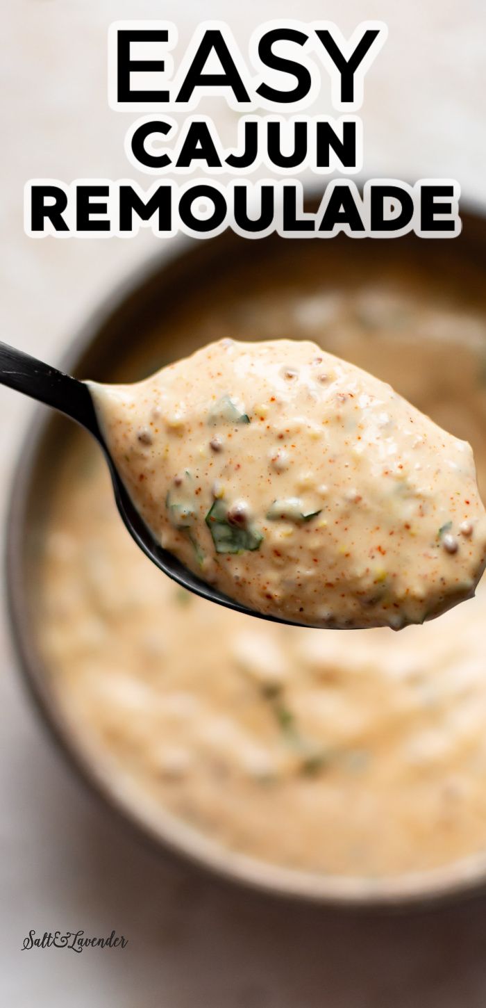 a spoon full of easy cajun remoulade with the title above it