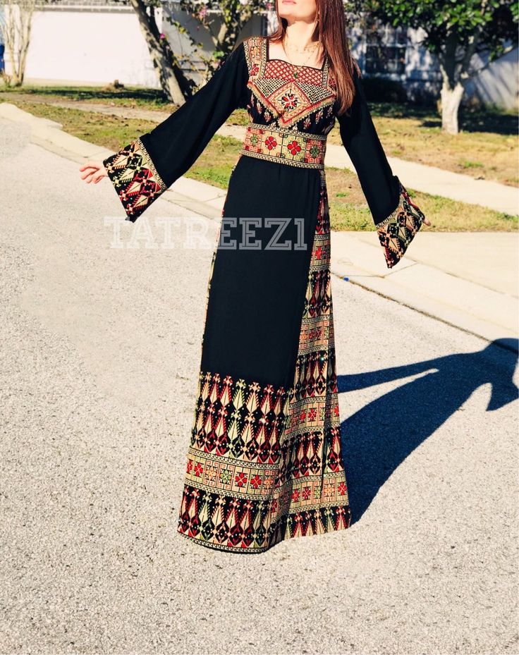 Beautiful Modern Black Embroidery Thoub ��– Tatreez1 Traditional Long Sleeve Maxi Dress With Multicolor Embroidery, Fitted Embroidered Black Abaya, Traditional Long Fitted Kaftan, Traditional Long Kaftan, Traditional Fitted Long Kaftan, Traditional Fitted Maxi Length Kaftan, Elegant Long Sleeve Dress With Embroidered Border, Black Long Sleeve Abaya With Floral Embroidery, Fitted Long Sleeve Abaya With Floral Embroidery