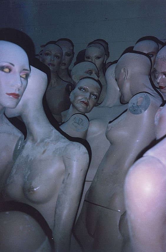 there are many mannequins with different facial expressions