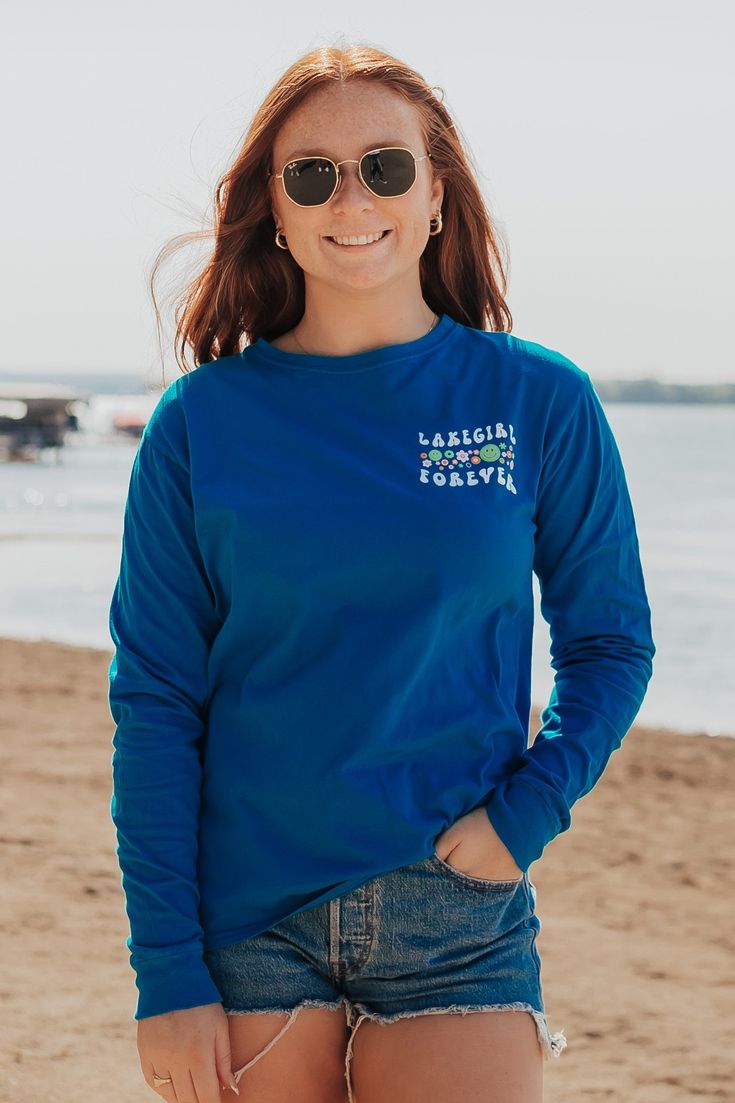 Not much can beat a day spent at the lake sipping and watching people sailing. Features a full screen print back and screen print left chest on a hawaiian blue ringspun long sleeve. 100% cotton Relaxed Fit Size Chart Lake Girl, Blue Hawaiian, At The Lake, Full Screen, Screen Print, Summer Collection, Exclusive Designs, Sailing, Womens Bottoms