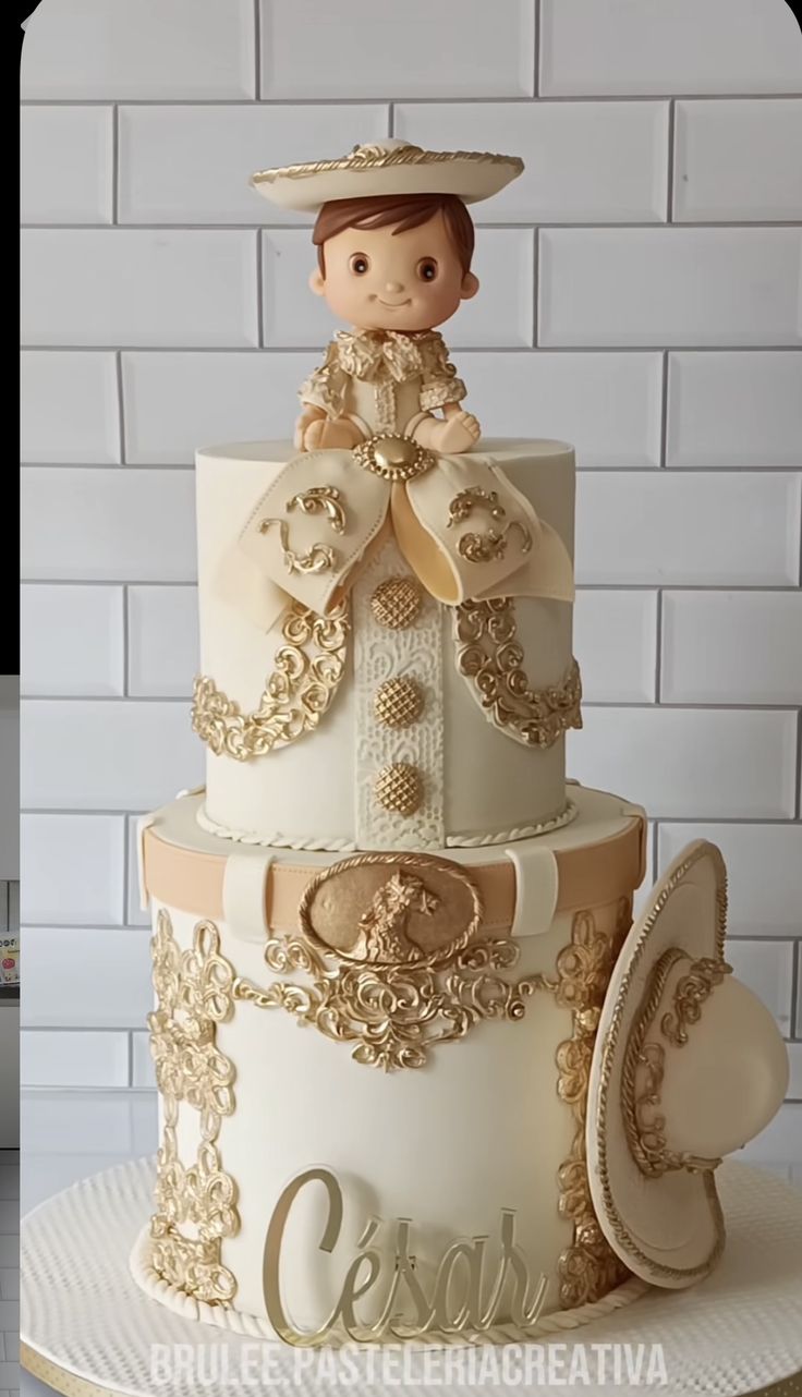 a three tiered cake with a doll on top