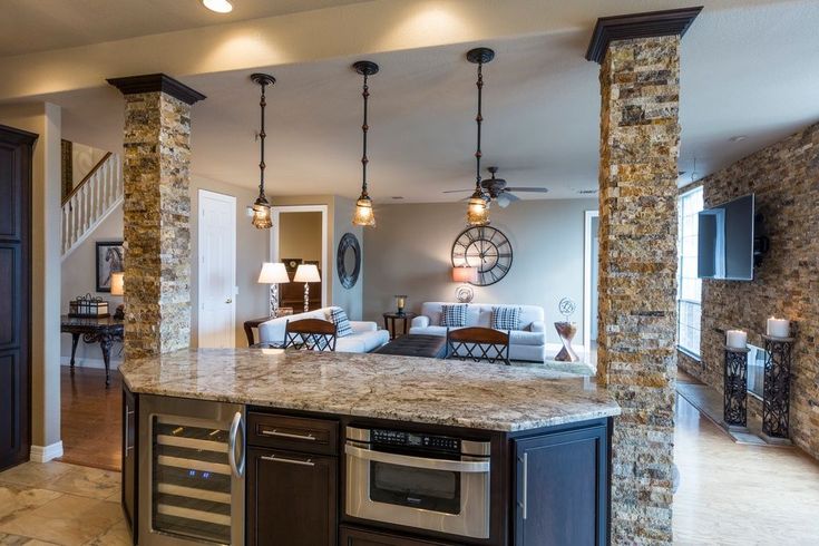 a kitchen and living room are shown in this house's open floorplan