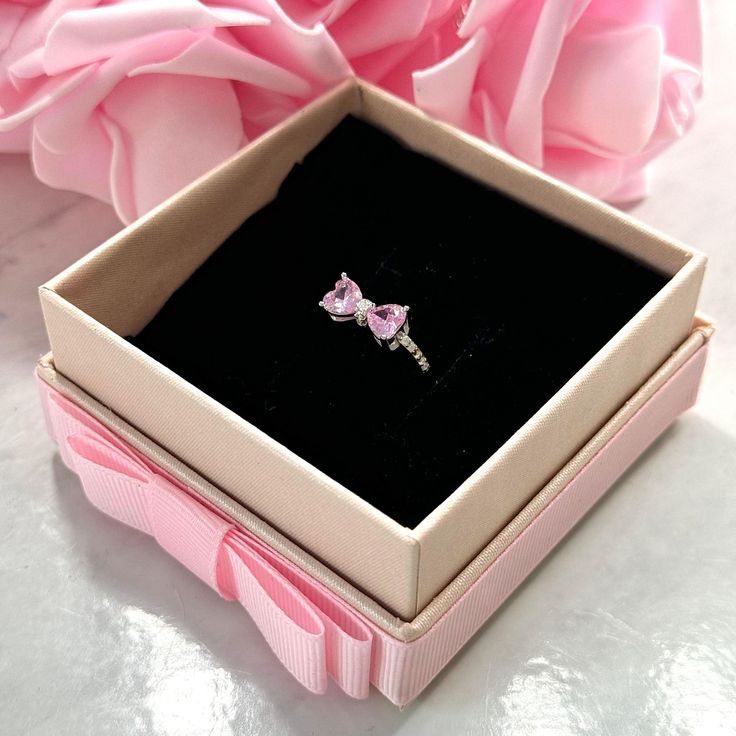 Our beautiful feminine "Pink Bow" ring is one of our Valentine's exclusive rings, delicately crafted to capture the beauty of femininity, this stunning ring is the perfect marriage between elegance and luxury. ♡ Size: Different sizes available♡ Material: Authentic S925 Sterling Silver♡ All of our jewelry are waterproof, tarnish-free and hypoallergenic. Very high-quality, made to last. Pink Promise Ring, The Perfect Marriage, Xmas Wishlist, Bow Ring, Pandora Rings, Perfect Marriage, November 13, Jewelry Diamonds, Gold Collection