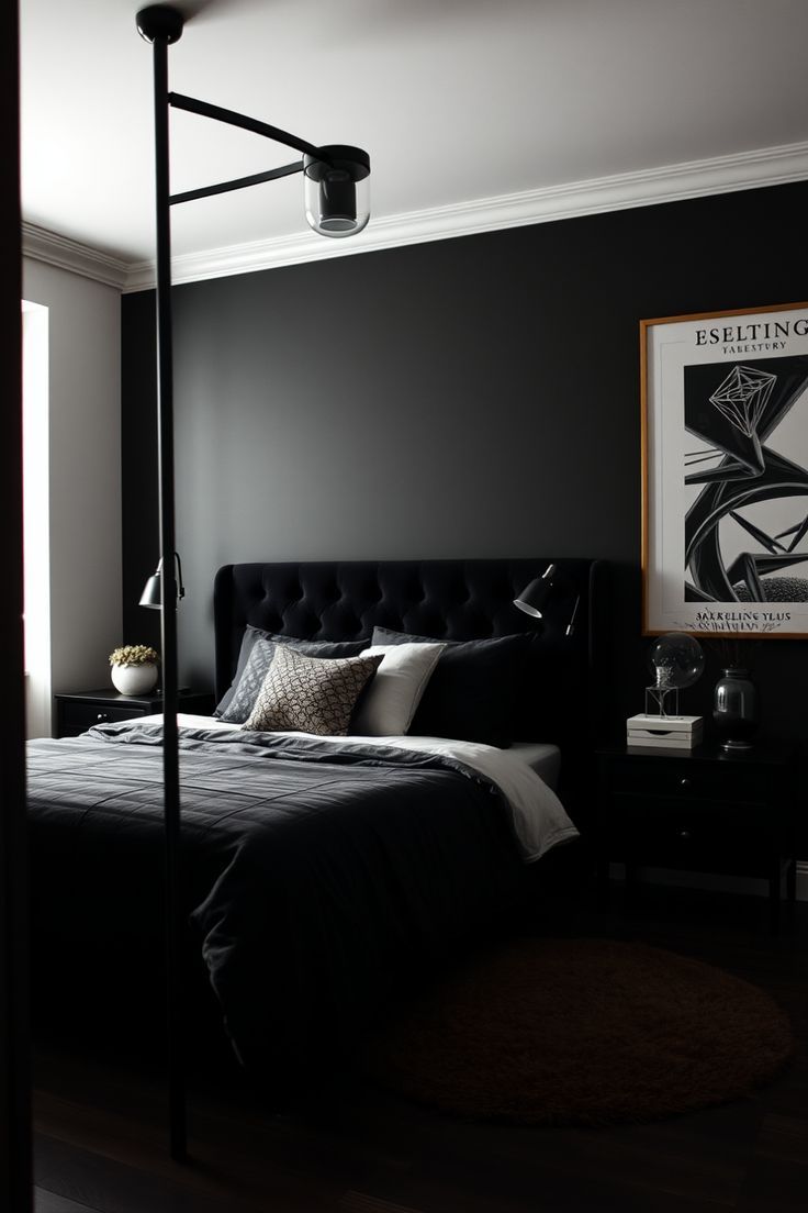 a black and white bedroom with a poster hanging on the wall above the headboard