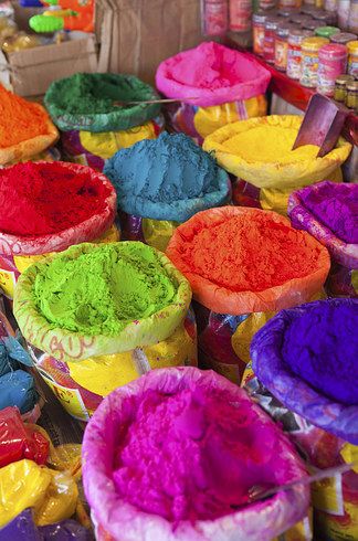 there are many different colored powders in bags