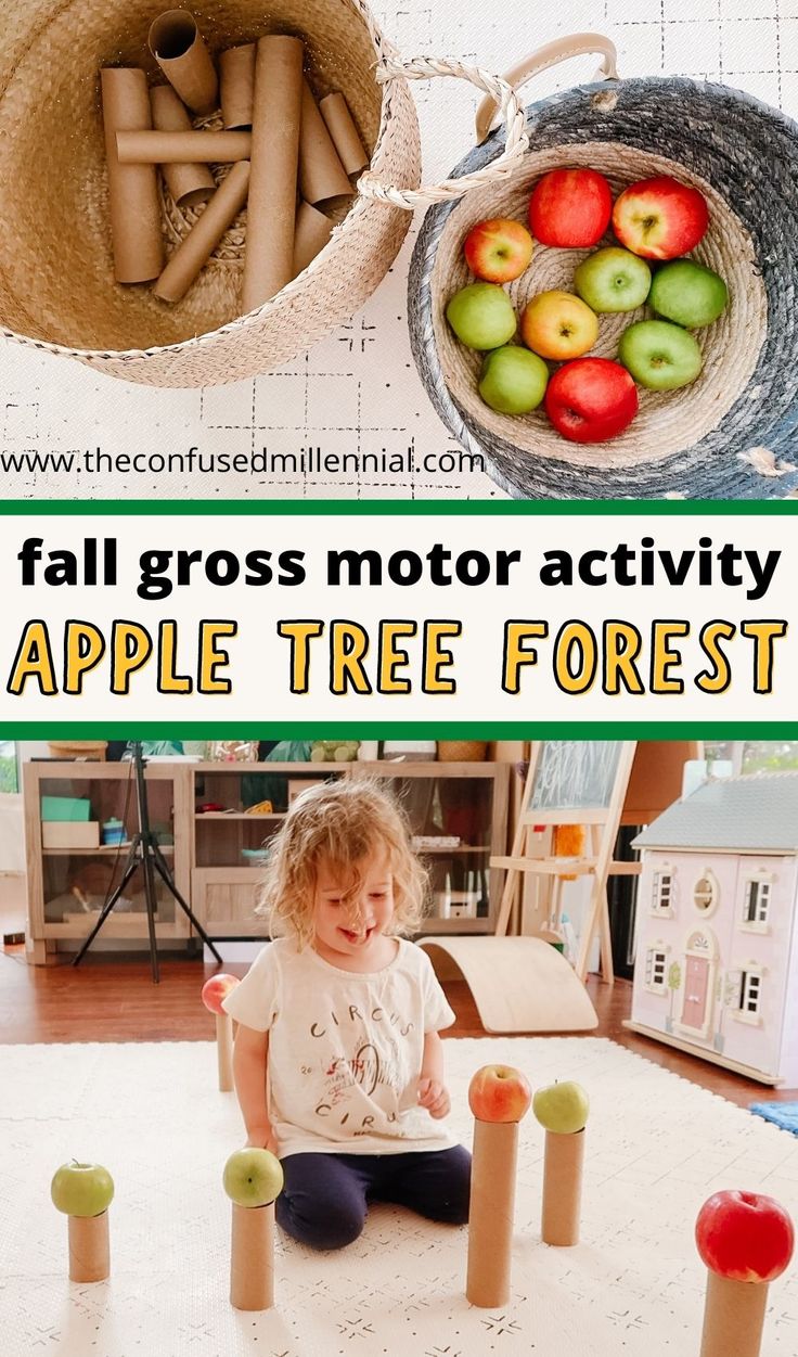 there is a small child sitting on the floor playing with apples and sticks in an apple tree forest