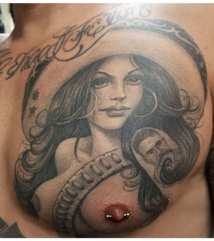 a woman's breast with a tattoo on it