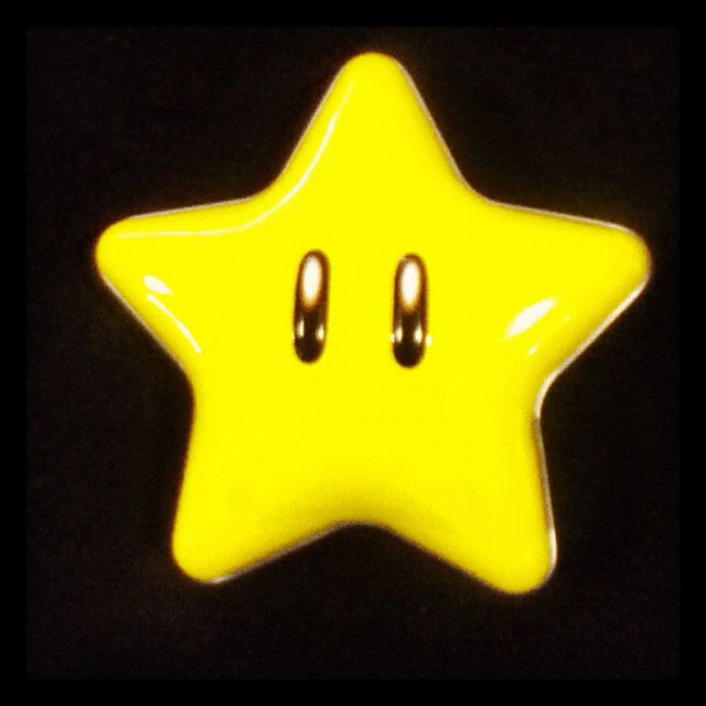 a yellow star shaped object with two black eyes