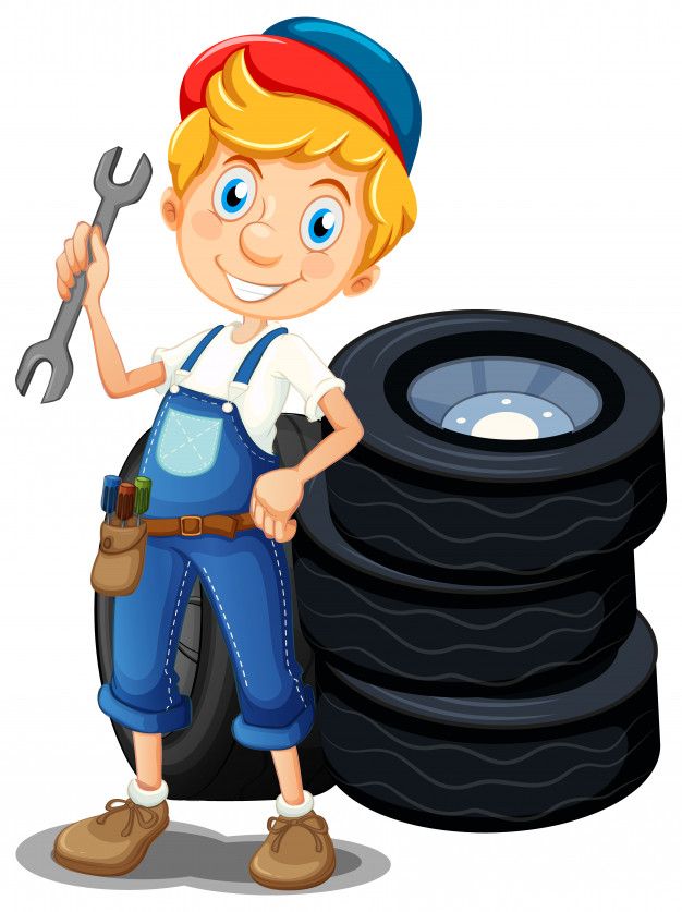 a boy holding a wrench next to tires