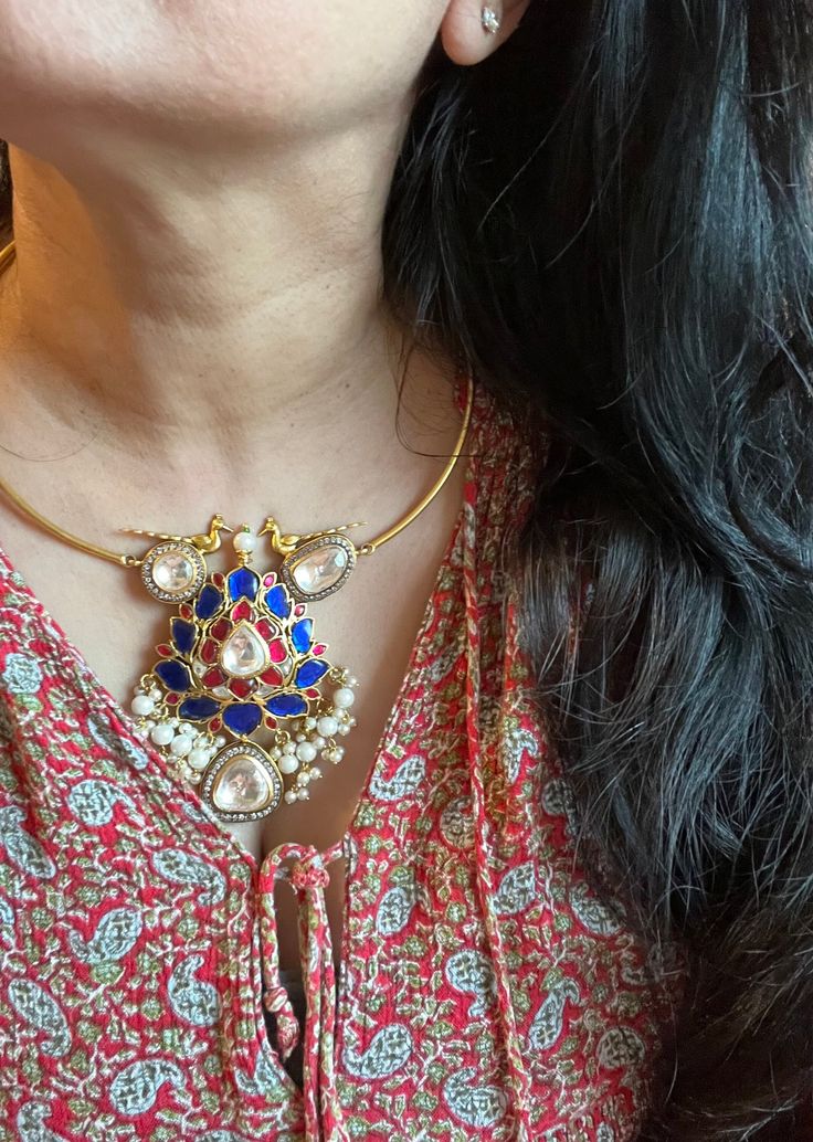 Premium quality. New arrivals for the festival season ♥️ The gorgeous necklace is beautifully handcrafted by our skilled Indian craftsmen. Material: Brass. This is one of a kind designer piece that will make you stand out among the crowd. Weight: 73 grams Height of Pendant: 3.5 inches Width of Pendant: 2.5 inches Hook closure, adjustable Festive Blue Necklace, Blue Pendant Necklace For Festivals, Unique Handmade Festive Necklaces, Festive Blue Round Necklace, Kundan Pendant Necklace For Gift, Kundan Pendant Necklace For Gifting, Heavy Pendant Necklaces For Celebration, Heavy Temple Jewelry Necklaces As Gift, Chandbali Necklaces For Celebrations And Festivals