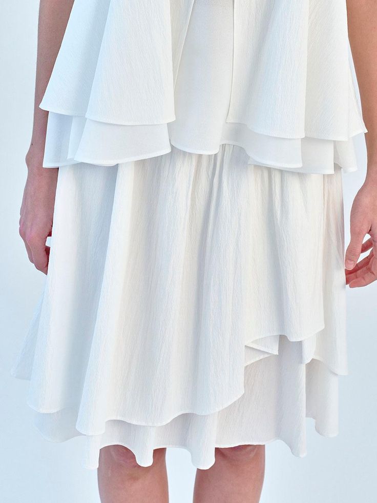 This is a trendy and feminine skirt by SO IR that is made out of high quality and sturdy material. With distinctive mood of the design and comfortable wear, you can style it for your casual daily outfit.- Shirring and tuck on the lining and shell- Midi length that drops below the knees- Feminine and minimal mood White Midi Ruffled Skirt, Chic Flowy Maxi Skirt With Layered Hem, Chic Tiered Maxi Skirt With Layered Hem, White Midi Length Voluminous Maxi Skirt, White Ruffled Midi Bottoms, White Ruffled Midi Length Bottoms, Flowy Ruffled Midi Length Skirt, Modern Mini Skirt For Summer, Feminine White Maxi Skirt For Day Out