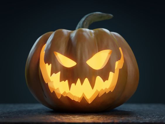 a carved jack o lantern with glowing eyes