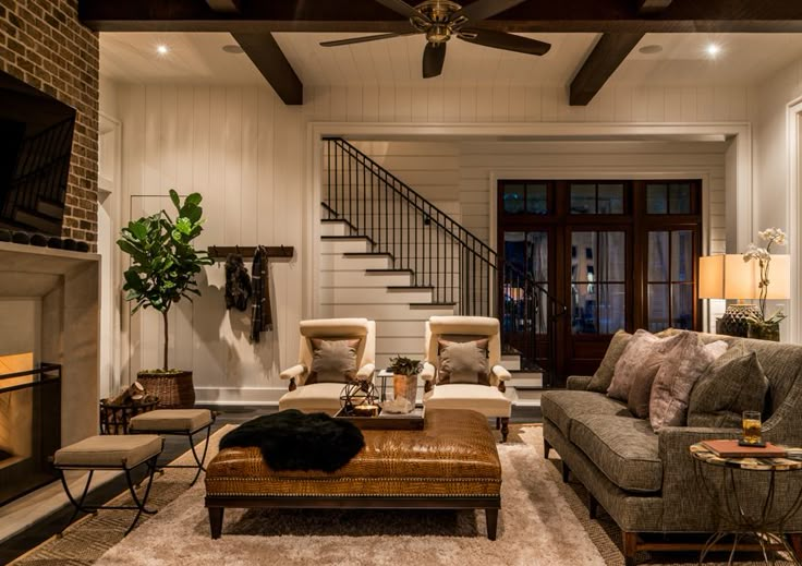 a living room filled with furniture and a fire place