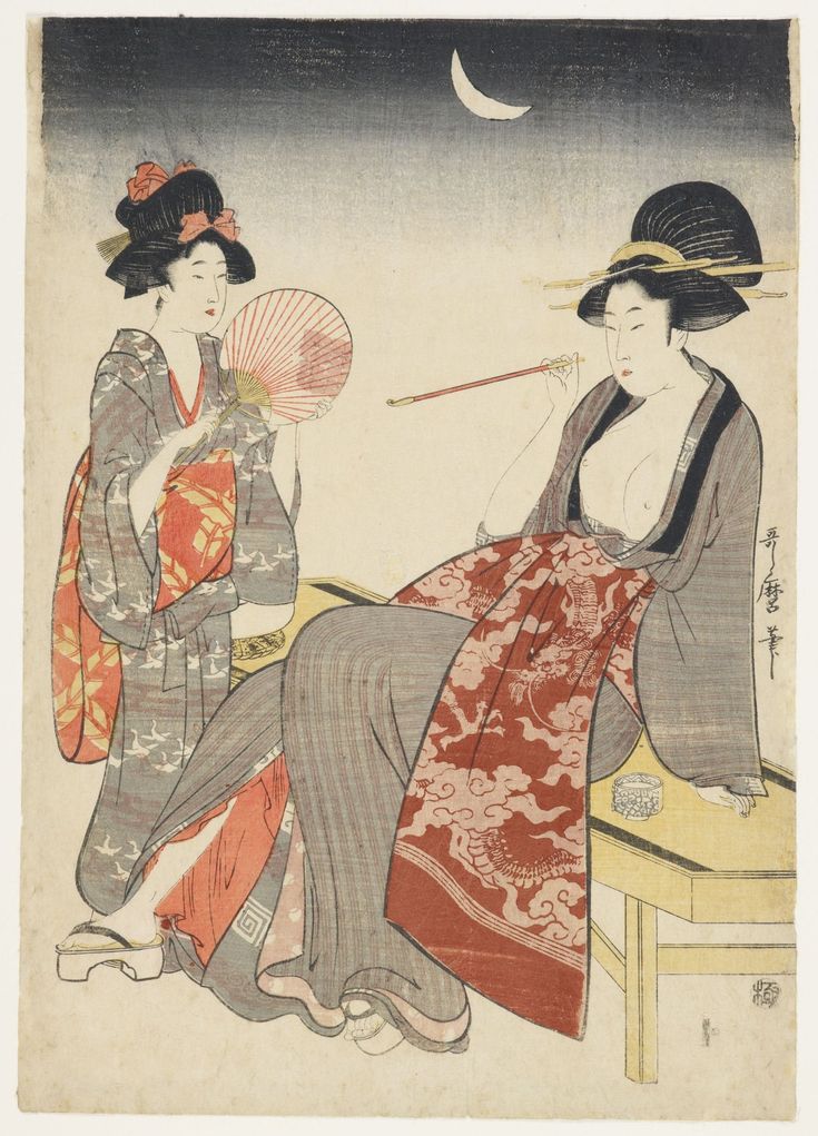 two geisha women sitting on a bench