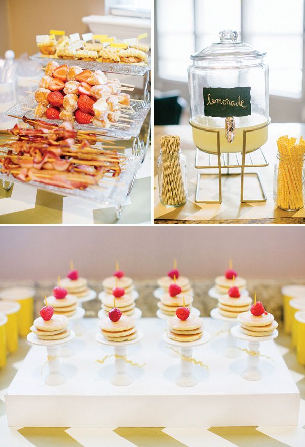 the dessert table is set up with cupcakes, strawberries and lemonade