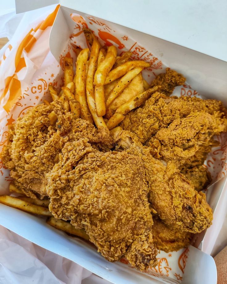 fried chicken and french fries in a basket