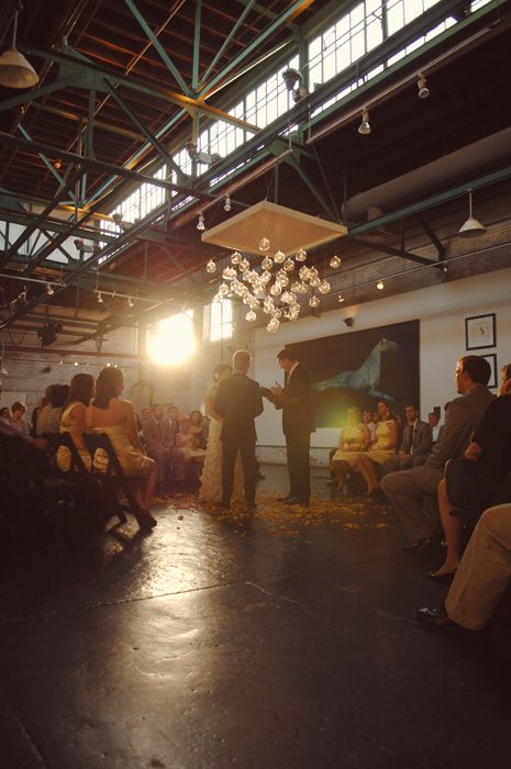 people are sitting in chairs and watching something on the screen