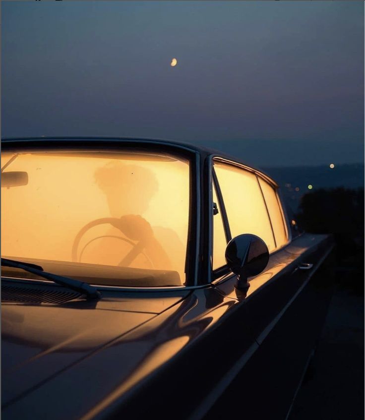 a car with the sun shining through it's windshield