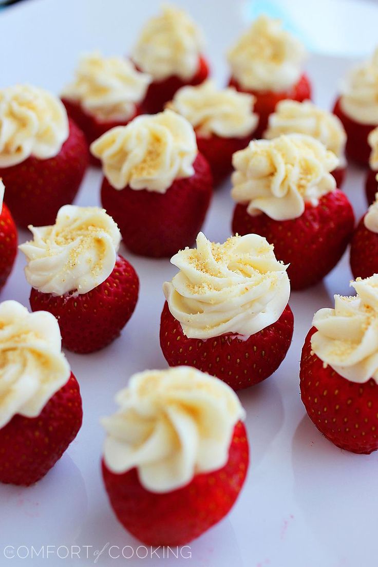 strawberries with white frosting and sprinkles on them