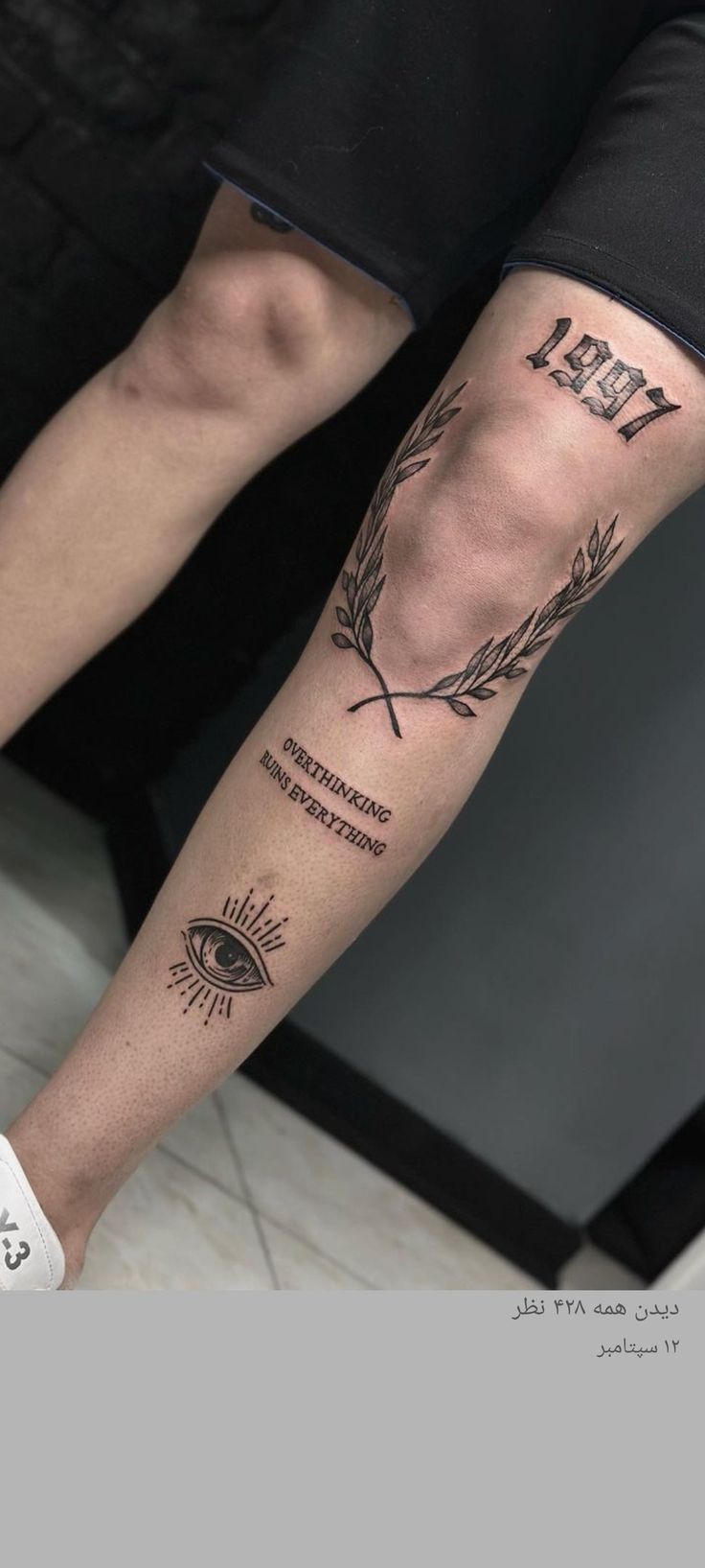 a person with a tattoo on their leg and an eye in the middle is shown