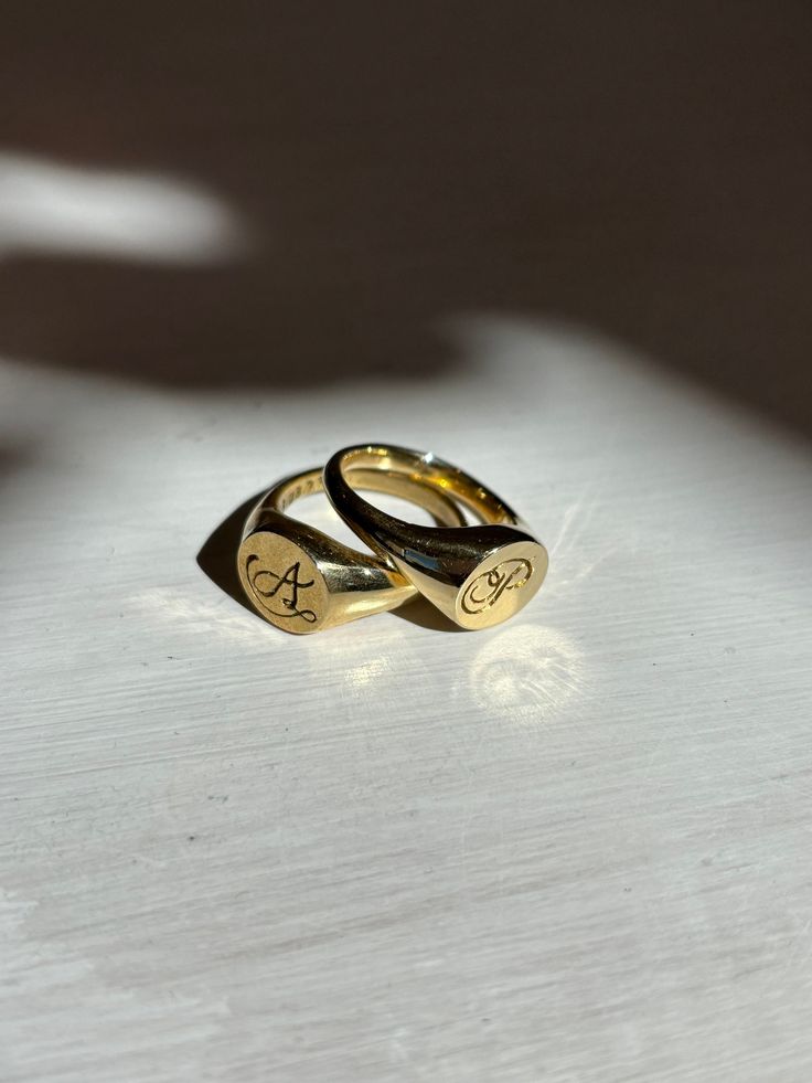 Hand carved signet ring with custom letter engraving. Perfect as a gift to a loved one, yourself, or both! These rings are modern in their deisgn but also have a vintage feel through the handwritten engravings.  Originally, I created these rings for my partner and I for our anniversary. I hand carved the signet ring from scratch out of wax, engraved the letters and our date into the wax ring, and cast them into brass. These are available to be made custom with any letter and in any metal!  **Ins Wax Ring, Our Anniversary, My Partner, Custom Letters, Signet Ring, Rings Statement, From Scratch, Statement Rings, Hand Carved