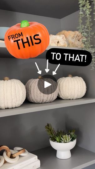 a shelf filled with fake pumpkins and other decorations