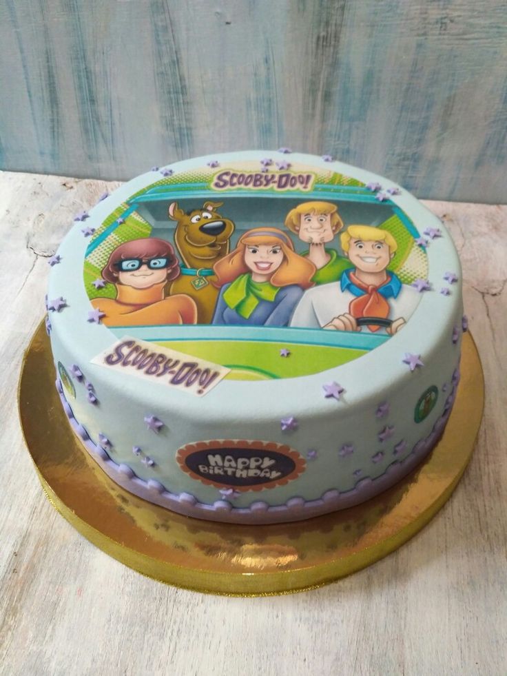 a birthday cake with cartoon characters on it