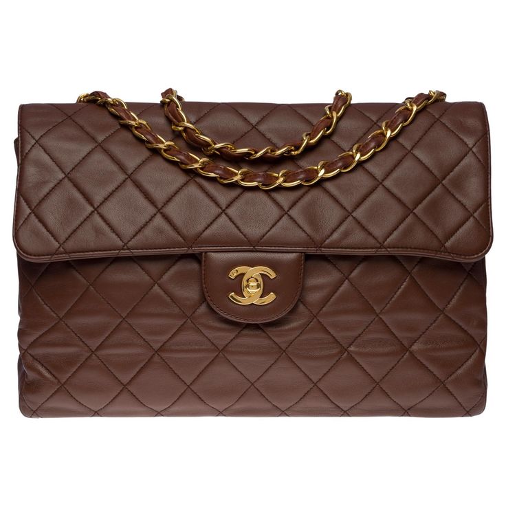 Majestic Chanel Timeless/Classic jumbo flap bag in brown quilted leather, gold metal hardware, a gold metal chain handle interlaced with brown leather for shoulder and shoulder strap Patch pocket on the back of the bag Flap closure, gold-plated CC clasp Single flap Brown leather lining, 1 zipped pocket in fabric, 1 patch pocket in leather Signature : "Chanel ®Made in France” Date : 1996 / 1997 Dimensions : 30 x 23 x 9 cm (12 x 9 x 3,5 Inches) Chain length : 50 cm (20 Inches) Reference : 100748 Packaging : Hologram : Yes Authenticity card : No Dustbag : No Box : No General condition : 7/10 In very good vintage condition despite marks of use on the leather and hardware. Please note that this bag went to a Chanel SPA for color retouching. Note a small smell of treatment Option in addition: Po Chocolate Brown Chanel Bag, Chanel Flap Bag Brown, Chanel Classic Flap Jumbo, Jumbo Chanel Bag, Chanel Brown Bag, Brown Chanel Bag, Brown Designer Bag, Chanel Vintage Bag, Brown Chanel