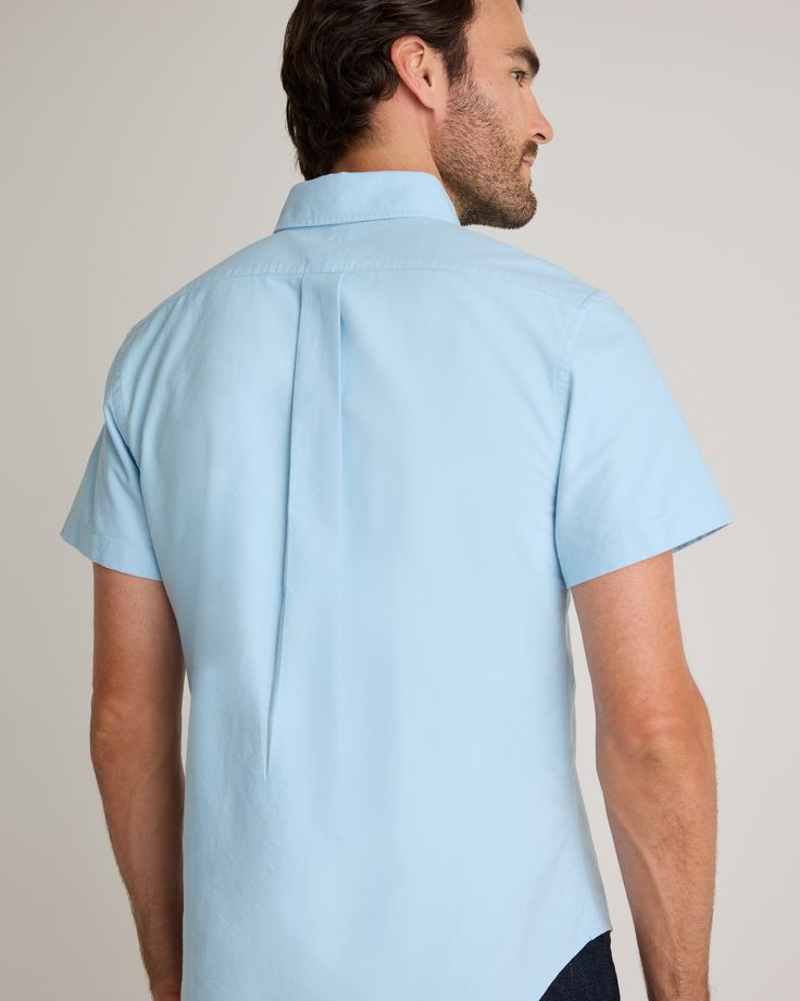 A forever essential, our 100% Organic Cotton Short Sleeve Oxford Shirt blends timeless style and everyday comfort. Crafted from premium organic cotton, the special enzyme wash process creates an ultra-soft handfeel so you can feel comfy all day without sacrificing any polish. Its classic look can flex for work or the weekend, making it a must-have for any wardrobe.  | Quince | Men's Short Sleeve Oxford Shirt in Light Blue, Size XXL, Organic Cotton Classic Cotton Button-up T-shirt, Washed Blue Cotton Button-up Shirt, Casual Blue Cotton Shirt, Everyday Solid Color Relaxed Fit Shirt, Everyday Relaxed Fit Solid Shirt, Light Blue Cotton Shirt For Work, Cotton Button-up Tops For Casual Gatherings, Light Wash Soft-washed Cotton Tops, Blue Cotton Tops For Casual Gatherings