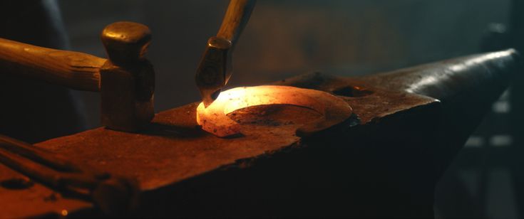 a piece of metal being worked on by a machine