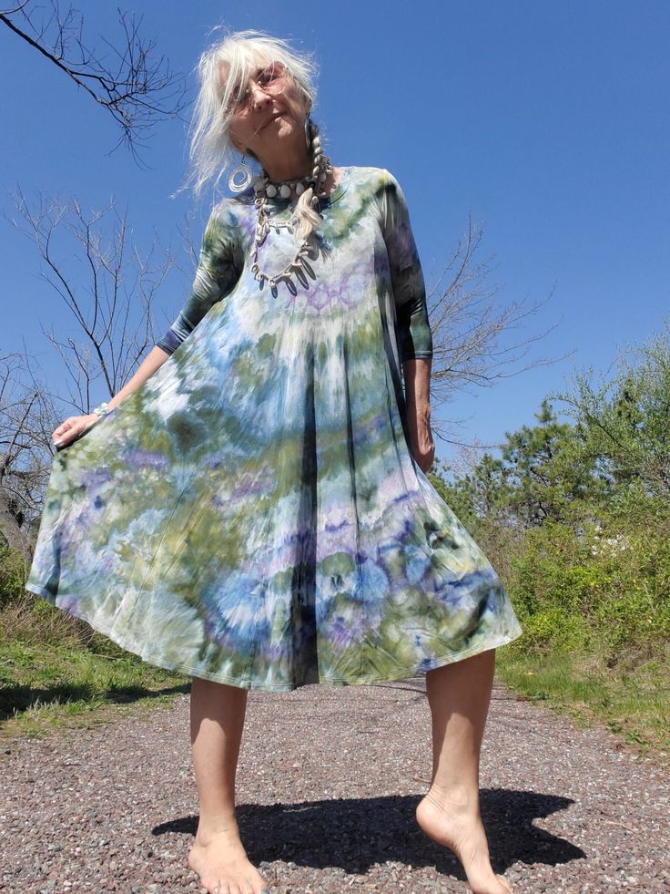 "Flowy Ice Dye Dress, Hand Dyed, S-3XL Flowy Curvy Midi Dress, Tie Dye Boho Dress, Plus Size Tie Dye, Xl, 2XL, 3XL This is a great midi-length dress with a feminine scoop neck, and ¾ sleeves, the body is created with several panels; it is formfitting on your upper body but very flowy below! Wear it by itself or with a belt! I'm modeling this color combo - a size small dress. I am 5'3\", 34-28-36. I'm also showing this dress style on a curvy model (wearing another color combo) My pretty friend is an L(XL), measuring 36DD-32-44. The XL fits her perfectly, but we have to point out that she does have an average 'large\" arm, the sleeve of the dress works for her, but she says it is arm hugging.  The fabric is pre-shrunk, has a great stretch, and the body drapes well. If you have big arms in pl Flowy Tie-dye Dress, Flowy Hand-dyed Tie Dye Dresses, Flowy Hand-dyed Tie-dye Dresses, Spring Hand-dyed Tie Dye Dresses, Spring Hand-dyed Tie-dye Dresses, Hand Dyed Flowy Spring Dresses, Hand Dyed Cotton Dresses For Spring, Hand Dyed Cotton Spring Dresses, Casual Tie Dye Dress With Natural Dye