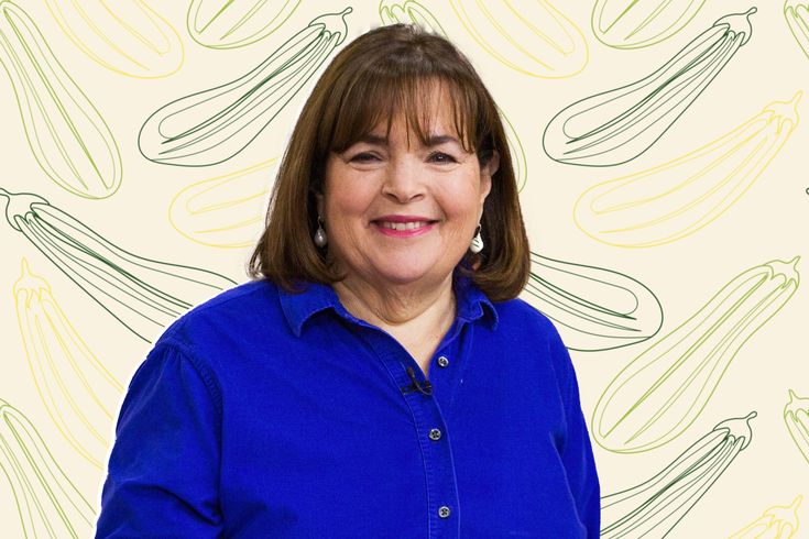 a woman standing in front of a wall with bananas on it