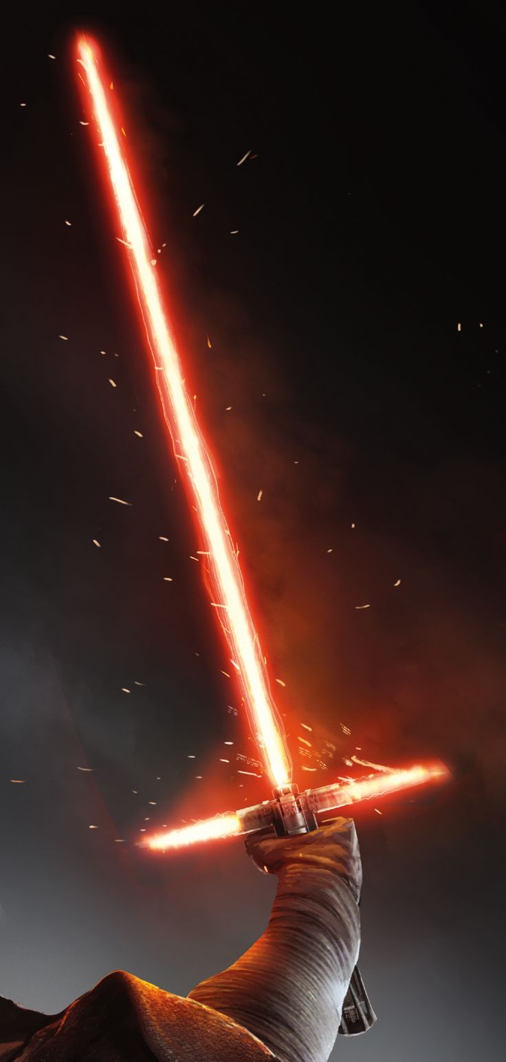 a person holding a light saber in their hand with fire coming out of the back