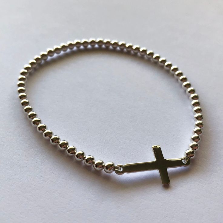 Silver Cross Bracelet - Sterling Silver Bracelet with Cross - Christening Gift Ideas - Cross Jewelry - Christian Jewelry - Meaningful Gift Sterling Silver 925 Weight: 3,2 g Length: 17 cm (6.69 inches), made on a strong rubber thread, so it can be slightly extended Dimensions of the cross: 2 cm x 1 cm (0.78 x 0.39 inches) Art.: M-49032B Made in Spain For more MOSA designs, please, visit my online store at www.BestSpanishShop.com Adjustable Silver Cross Beaded Bracelets, Adjustable Silver Beaded Bracelets With Cross Shape, Adjustable Silver Beaded Cross Bracelets, Bracelet With Cross, Silver Cross Bracelet, Pomegranate Necklace, Pomegranate Jewelry, Jewelry Techniques, Christian Jewelry