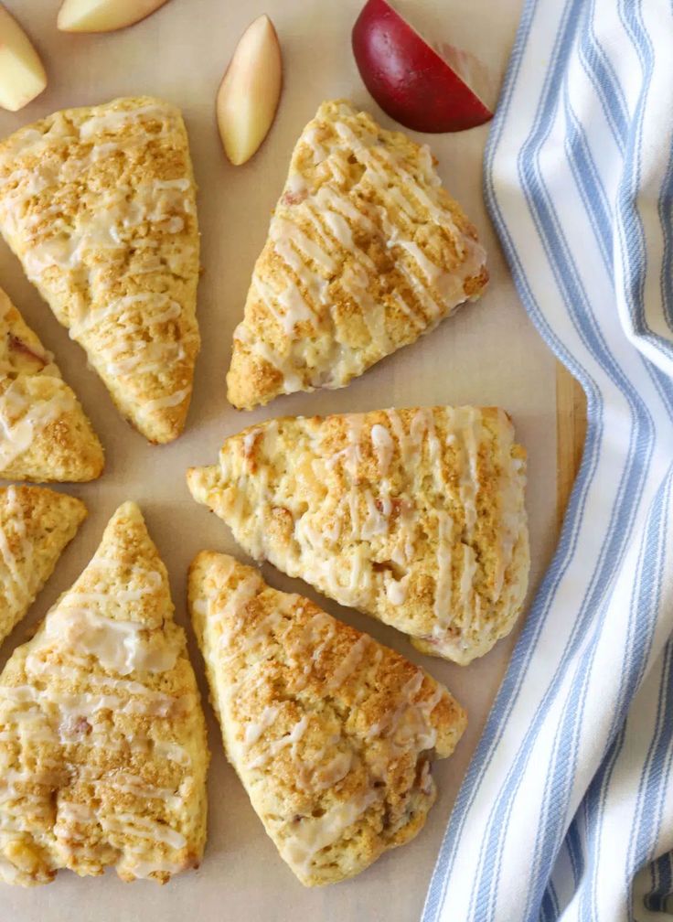 peach scones on a cutting board with apples in the background and text overlay that reads peach scones