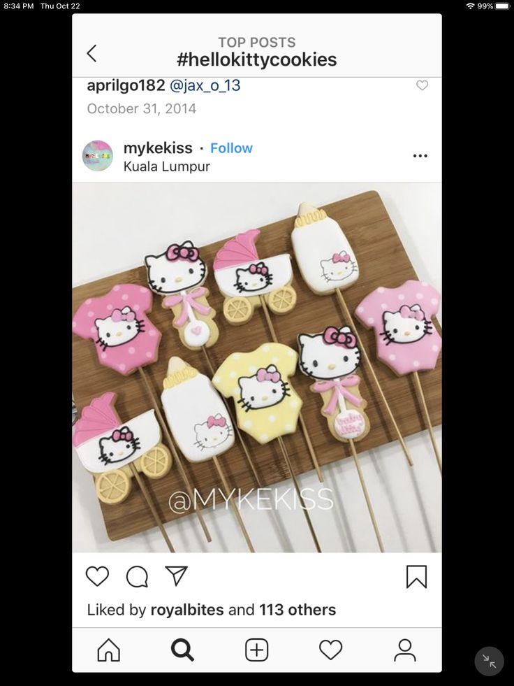 some hello kitty cookies on top of wooden sticks