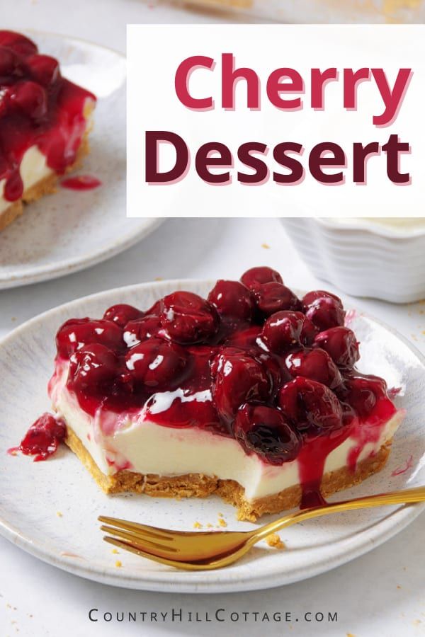 there is a piece of cheesecake with cherries on it