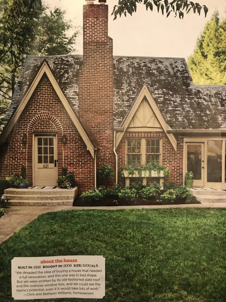 an advertisement for a brick house in the grass